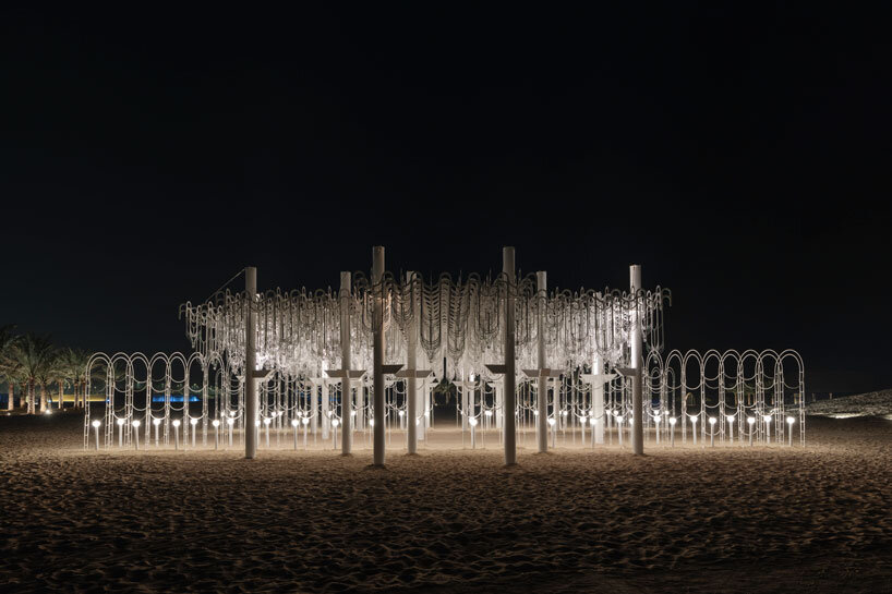 cloud-like white canopy of hanging vines emerges from abu dhabi&rsquo;s arid landscape
