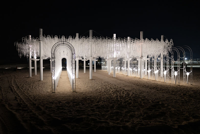 cloud-like white canopy of hanging vines emerges from abu dhabi&rsquo;s arid landscape
