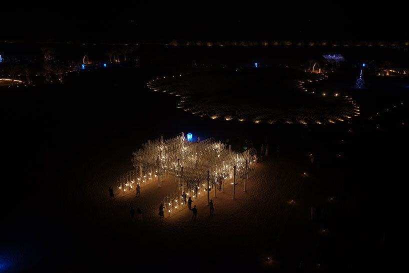 cloud-like white canopy of hanging vines emerges from abu dhabi&rsquo;s arid landscape