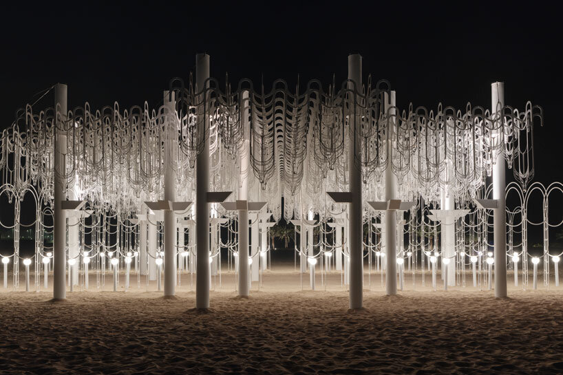 cloud-like white canopy of hanging vines emerges from abu dhabi&rsquo;s arid landscape