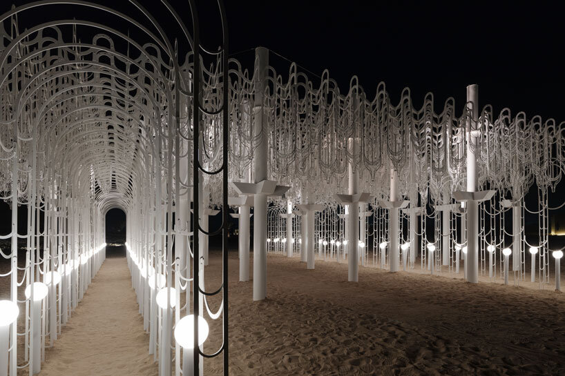 cloud-like white canopy of hanging vines emerges from abu dhabi&rsquo;s arid landscape