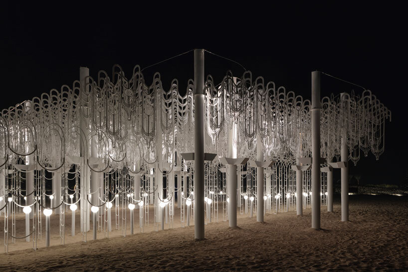cloud-like white canopy of hanging vines emerges from abu dhabi&rsquo;s arid landscape