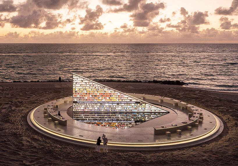 es devlin's triangular bookshelf rotates within a mirrored pool for miami art week 2025