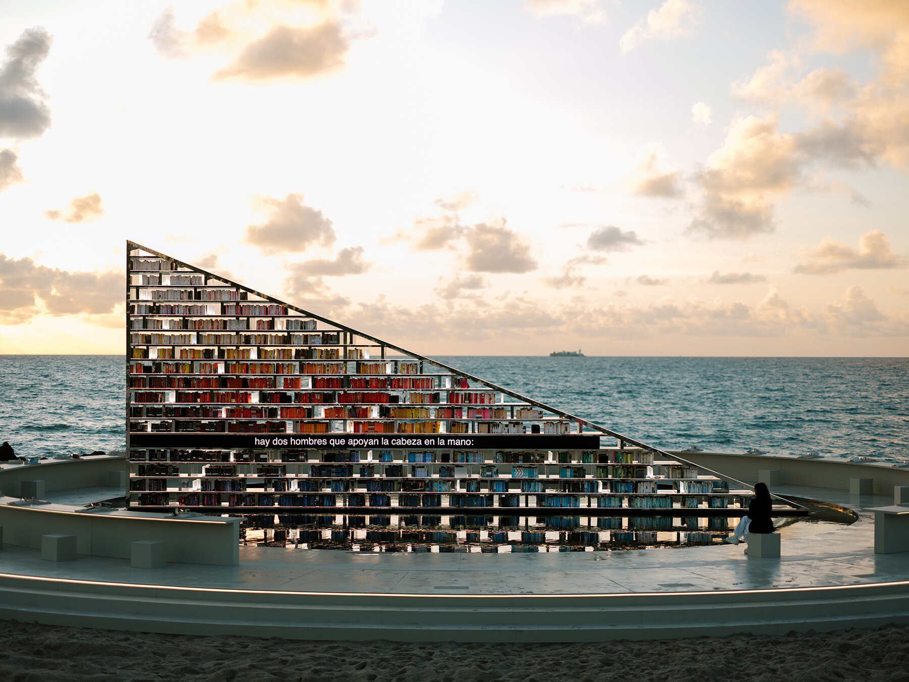 es-devlin-triangular-bookshelf-mirrored-pool-miami-art-week-faena-designboom-large02