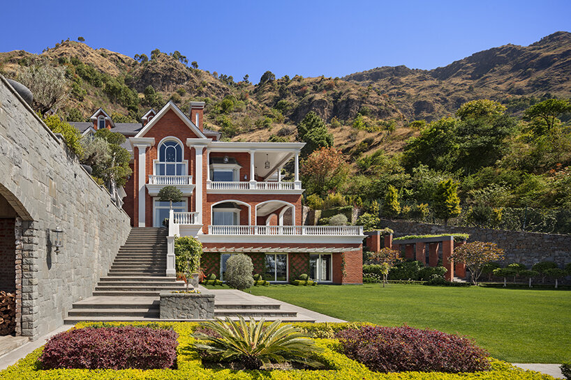 stepped residence embedded into the hillside maximizes views and privacy in india