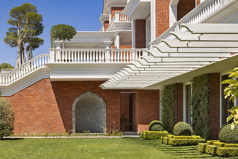 stepped residence embedded into the hillside maximizes views and privacy in india