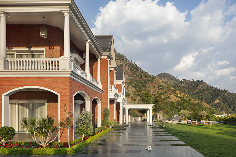 stepped residence embedded into the hillside maximizes views and privacy in india