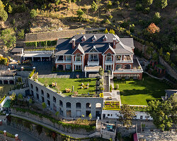 stepped residence embedded into the hillside maximizes views and privacy in india