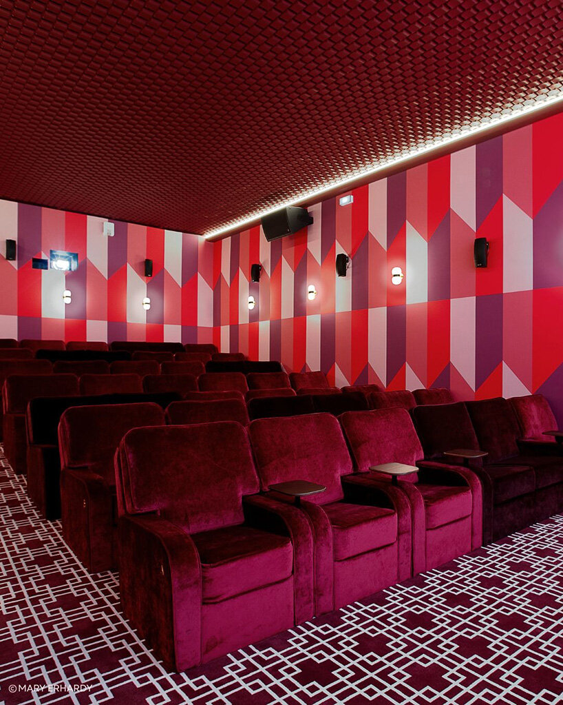 historic parisian cinema is reborn in wes anderson-like pastel hues and velvet touches