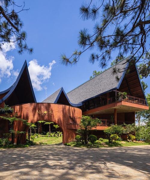 interlinked peaks shape bistro’s rhythmic canopy echoing mountain ridge in vietnam
