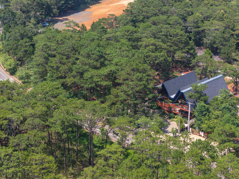 interlinked peaks shape bistro’s rhythmic canopy echoing mountain ridge in vietnam