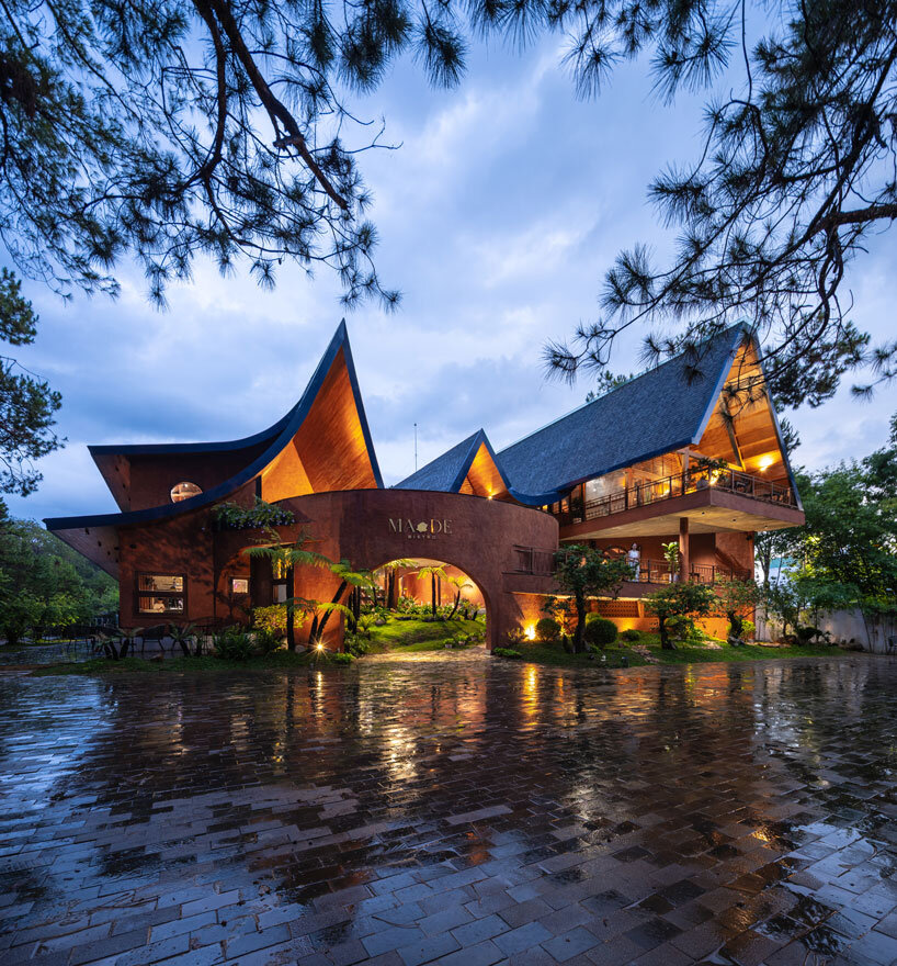 interlinked peaks shape bistro’s rhythmic canopy echoing mountain ridge in vietnam