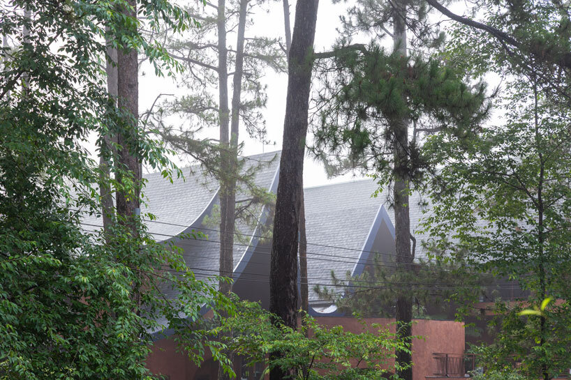 interlinked peaks shape bistro’s rhythmic canopy echoing mountain ridge in vietnam