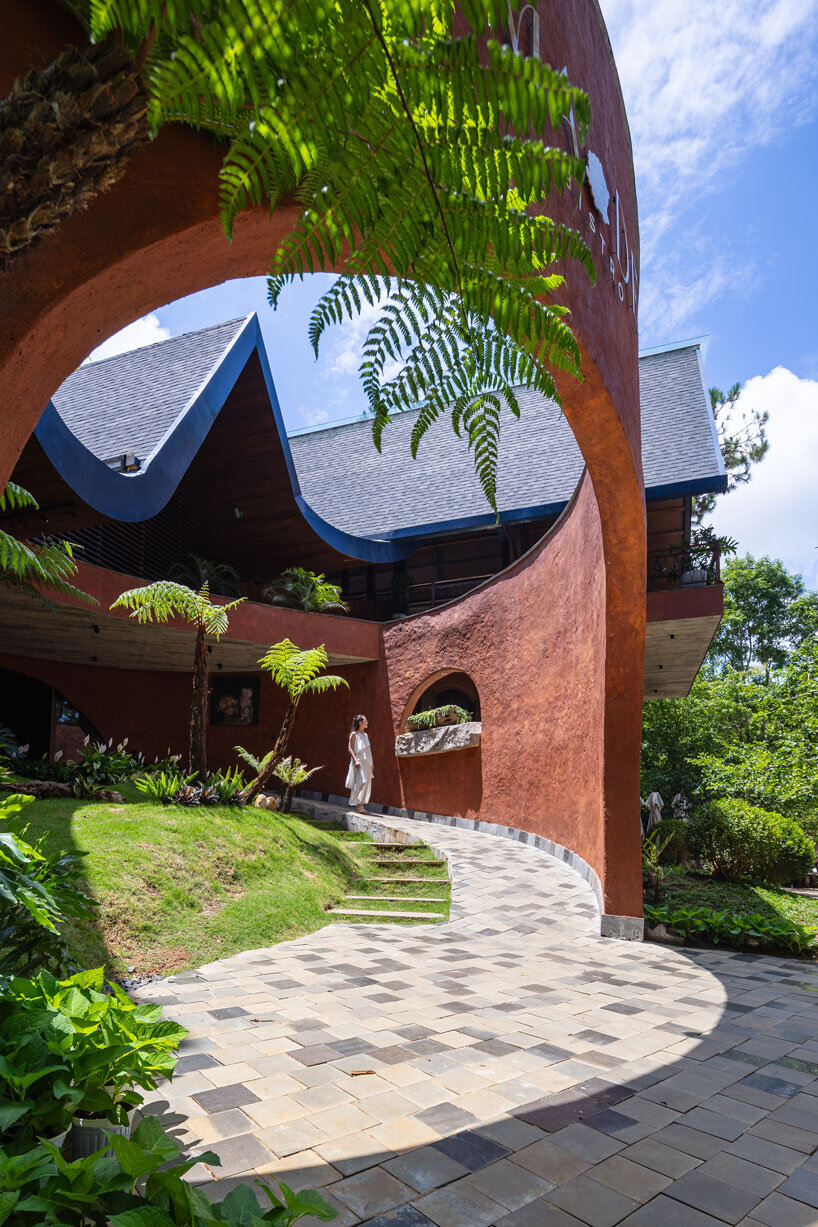 interlinked peaks shape bistro’s rhythmic canopy echoing mountain ridge in vietnam