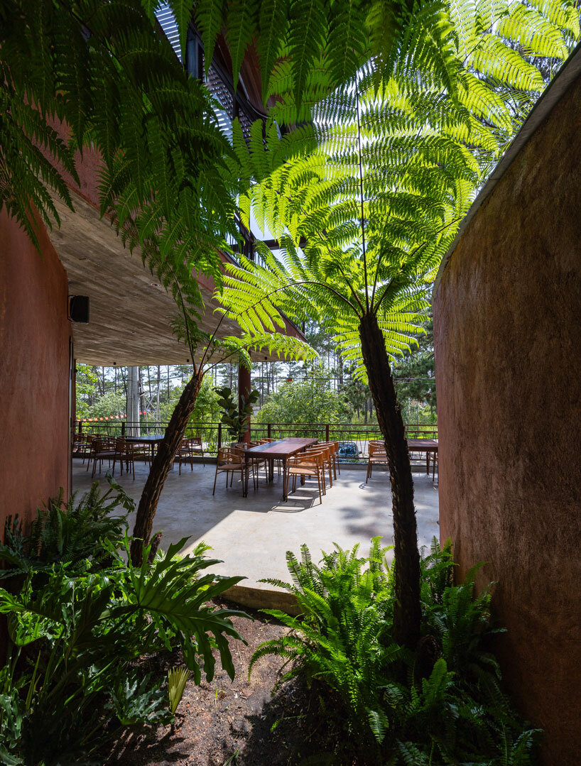 interlinked peaks shape bistro’s rhythmic canopy echoing mountain ridge in vietnam