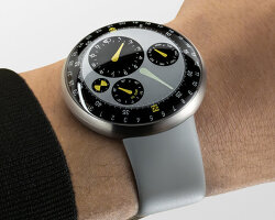 marc newson crafts ressence watch with hands suspended in removable oil-filled chamber