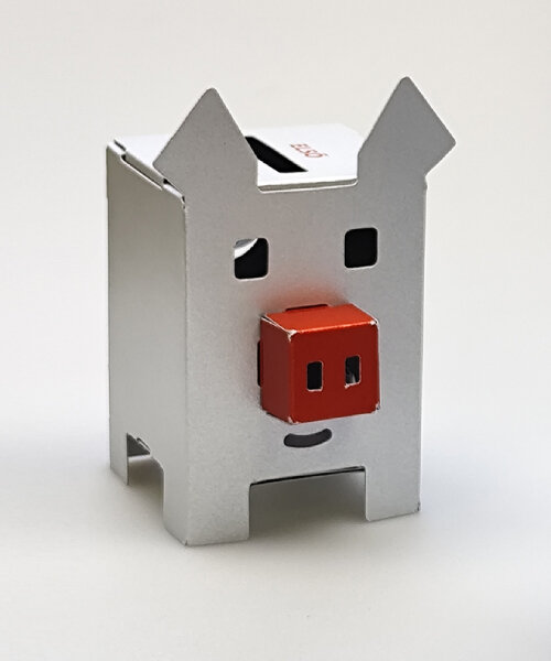 metallic piggy bank made of paper encourages young people to save money and donate