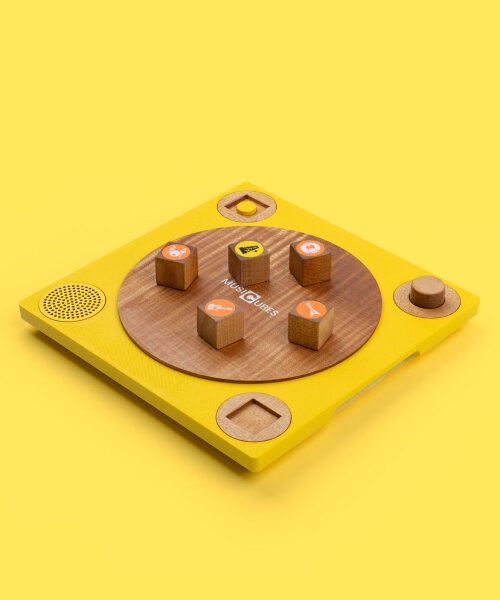 musical wooden cubes produce instrumental sounds when placed on smart vinyl-like board
