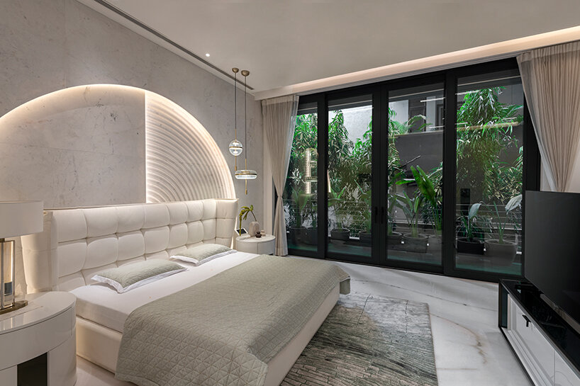 atrey and associates' brutalist home pairs climatic intelligence with material honesty