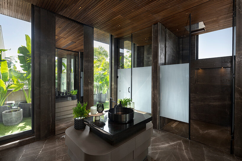 atrey and associates' brutalist home pairs climatic intelligence with material honesty