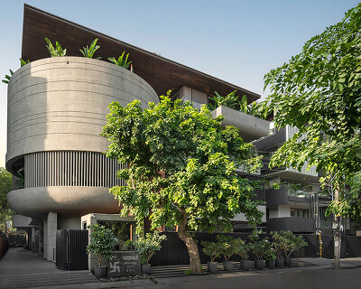 atrey and associates' brutalist home pairs climatic intelligence with material honesty