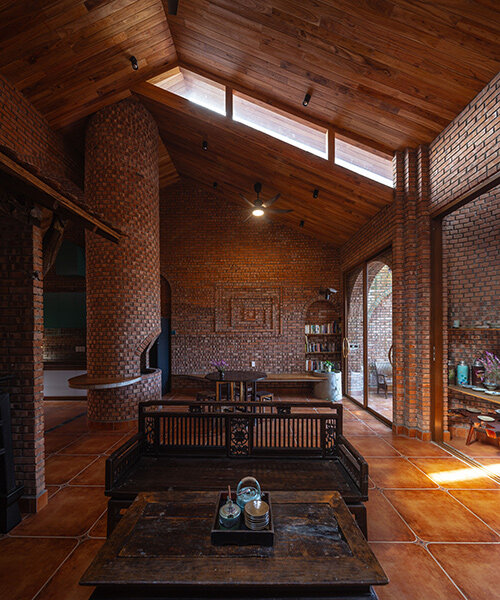 textural brickwork shapes trung tran studio's breezy 'nang house' in rural vietnam