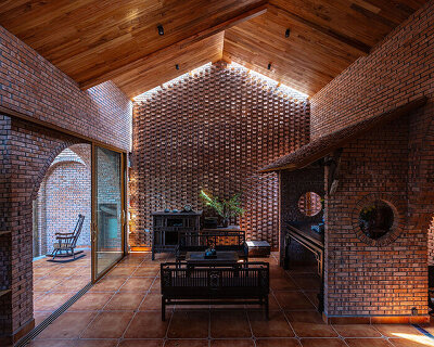 textural brickwork shapes trung tran studio's breezy 'nang house' in rural vietnam