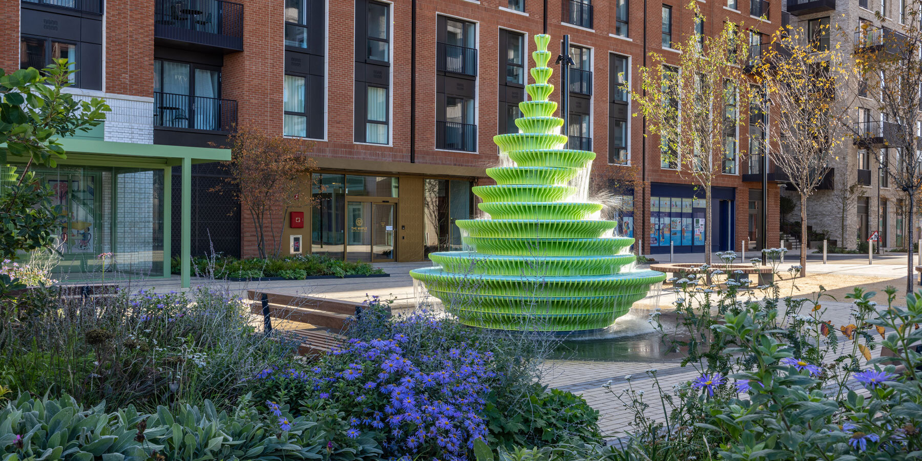 neon-fountain-sculptural-water-feature-brent-cross-town-london-designboom-1800-2