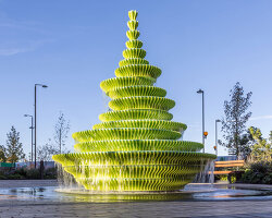 NEON stacks sculptural plates into bright green asymmetrical fountain in london