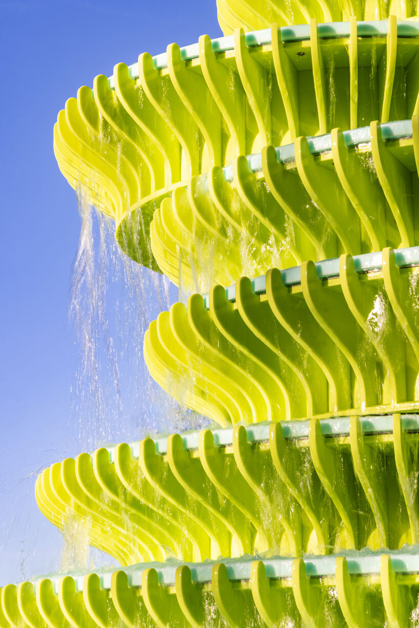 NEON stacks sculptural plates into bright green asymmetrical fountain in london