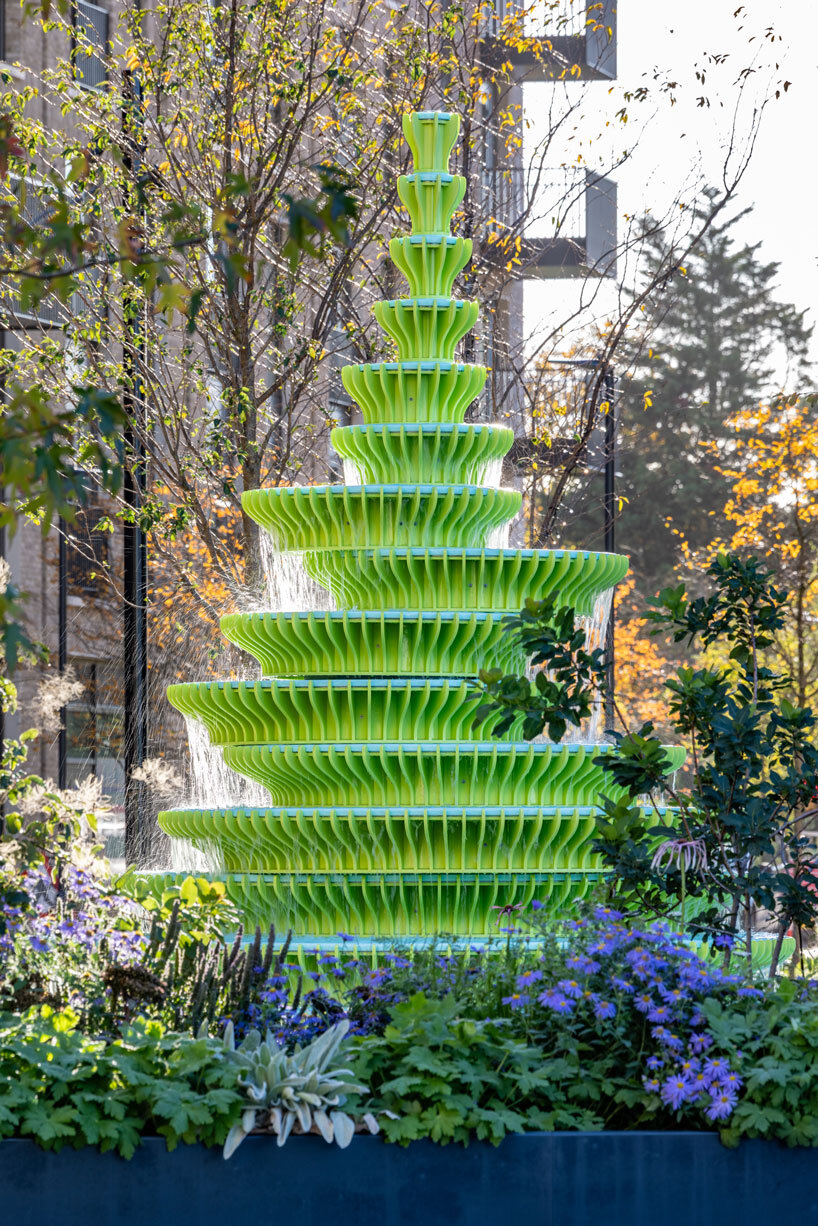 NEON stacks sculptural plates into bright green asymmetrical fountain in london
