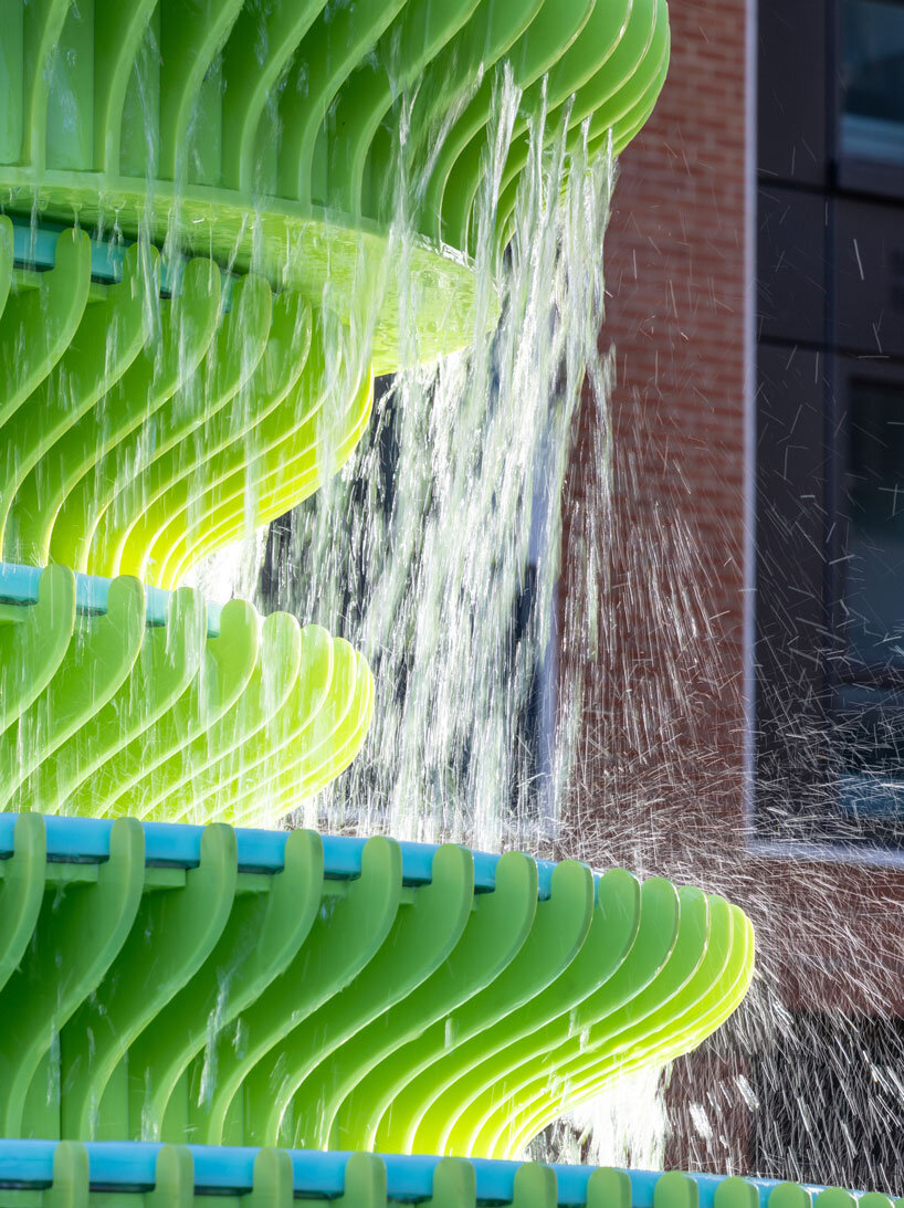 NEON stacks sculptural plates into bright green asymmetrical fountain in london