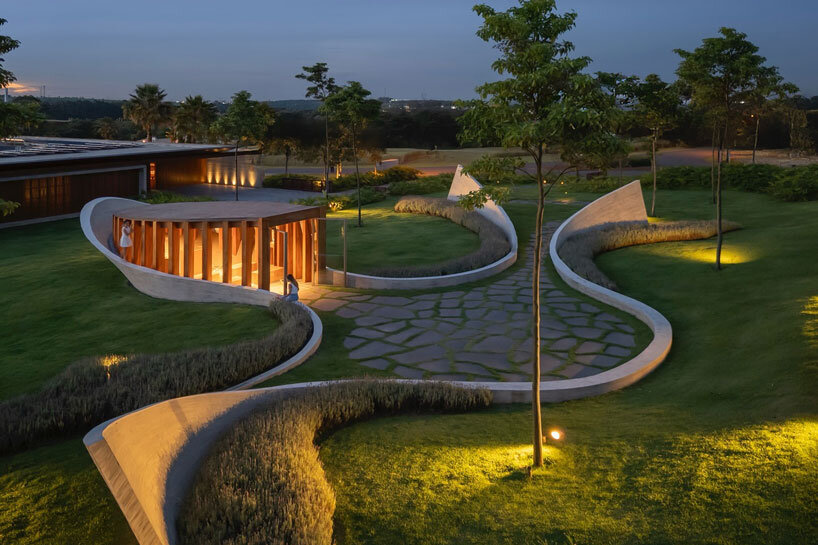 curving concrete walls encircle nest chapel’s intimate timber core in são paulo