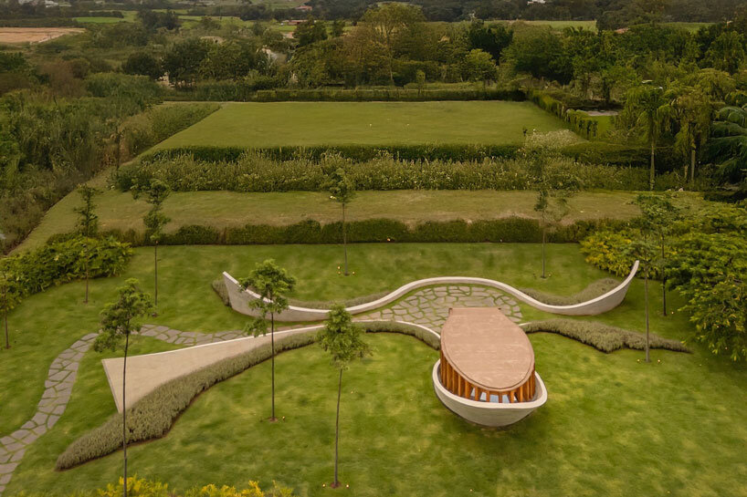 curving concrete walls encircle nest chapel’s intimate timber core in são paulo