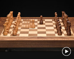 crafted in solid walnut and maple, phantom is the world’s first robotic chessboard