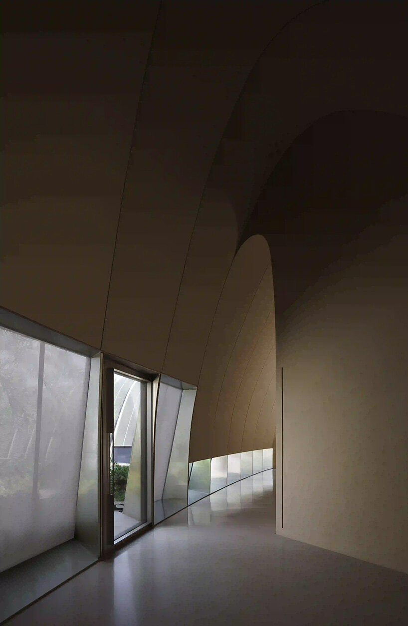 RCR arquitectes' house rises like a blooming structure of ribbed petals in the dubai desert