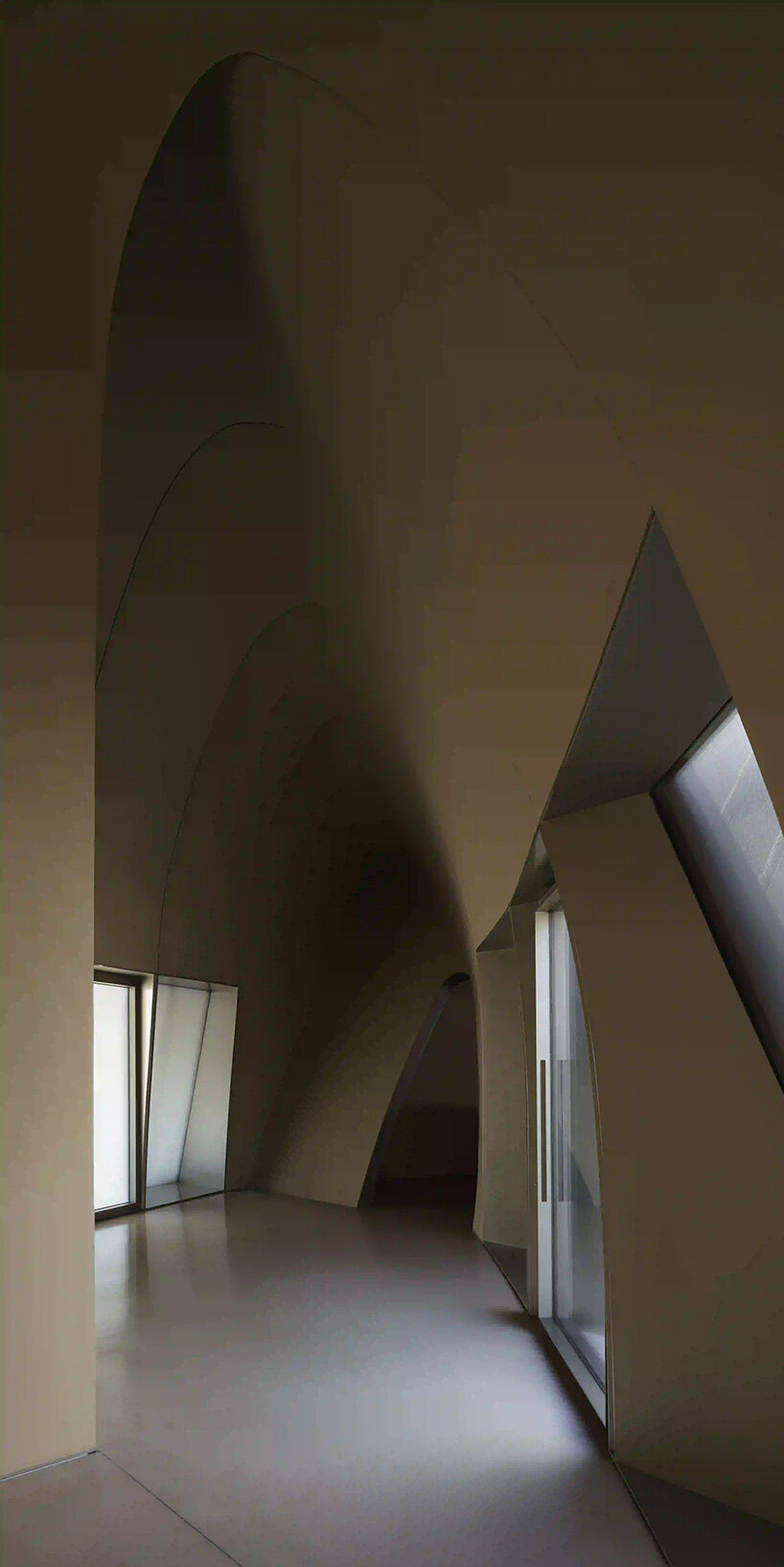 RCR arquitectes' house rises like a blooming structure of ribbed petals in the dubai desert