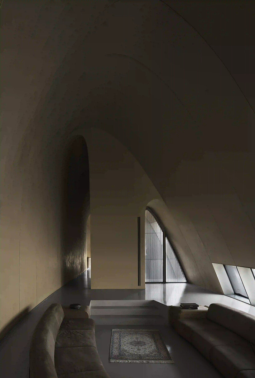 RCR arquitectes' house rises like a blooming structure of ribbed petals in the dubai desert