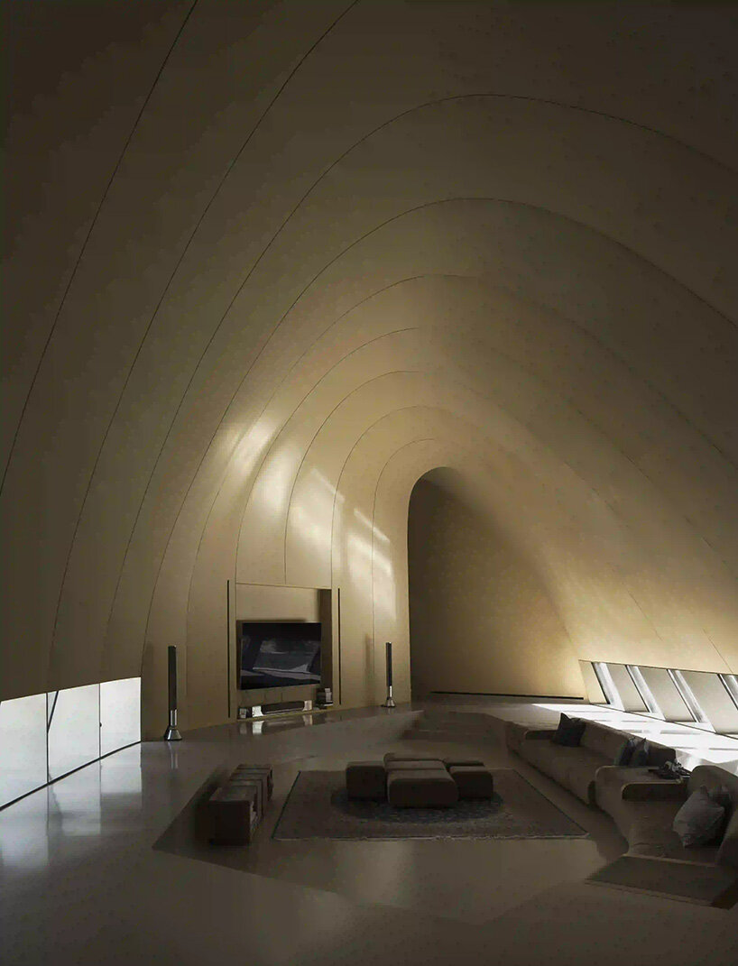 RCR arquitectes' house rises like a blooming structure of ribbed petals in the dubai desert