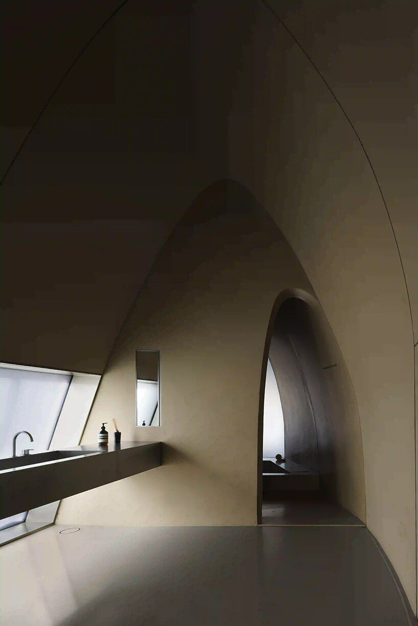 RCR arquitectes' house rises like a blooming structure of ribbed petals in the dubai desert