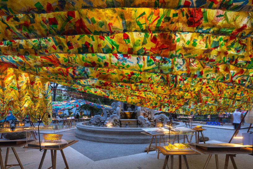 lantern-like pavilion glowing within the urban landscape