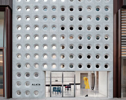 sculptural marble facade by halleroed fronts alaïa's first china flagship in beijing