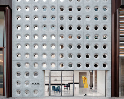 sculptural marble facade by halleroed fronts alaïa's first china flagship in beijing