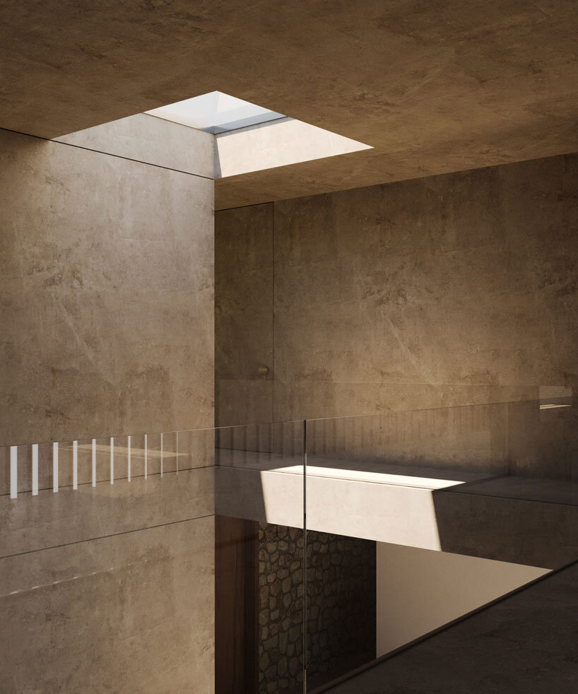 clad in timber, stone house by SHOVK perches over rocky oceanfront slope in portugal