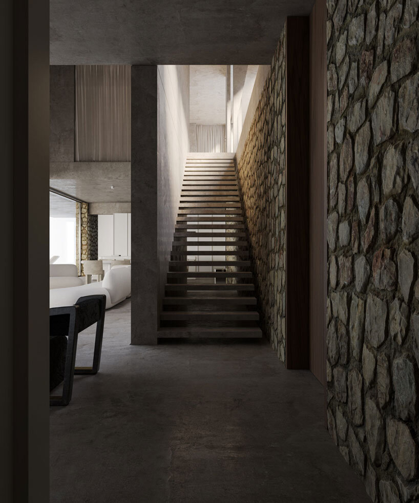clad in timber, stone house by SHOVK perches over rocky oceanfront slope in portugal