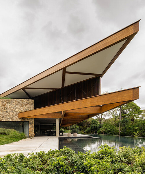 TETRO's lakeside residence in brazil vanishes into the horizon beneath triangular timber roof