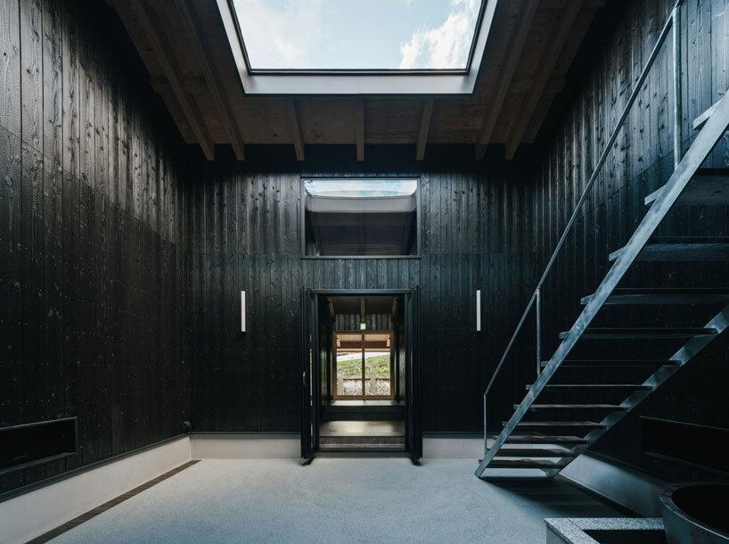 charred cedar facade enfolds kiln-inspired sauna in japan