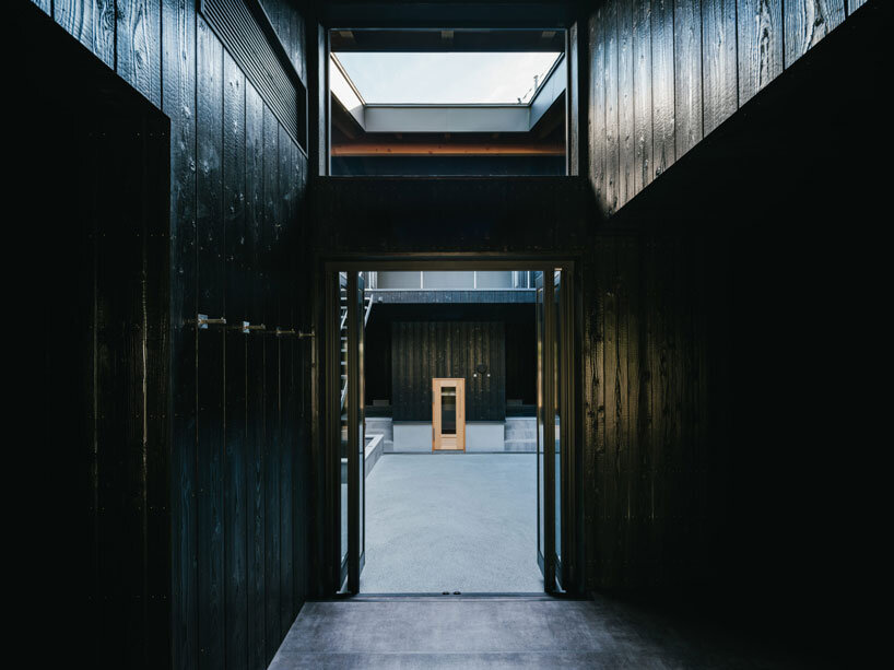 charred cedar facade enfolds kiln-inspired sauna in japan