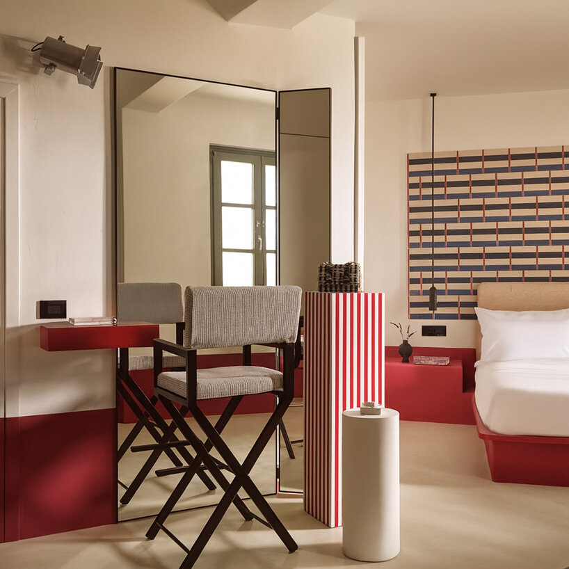 urban soul project redefines the santorini palette through bold red hotel design