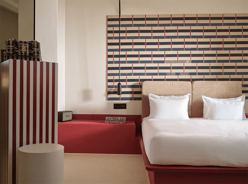 urban soul project redefines the santorini palette through bold red hotel design